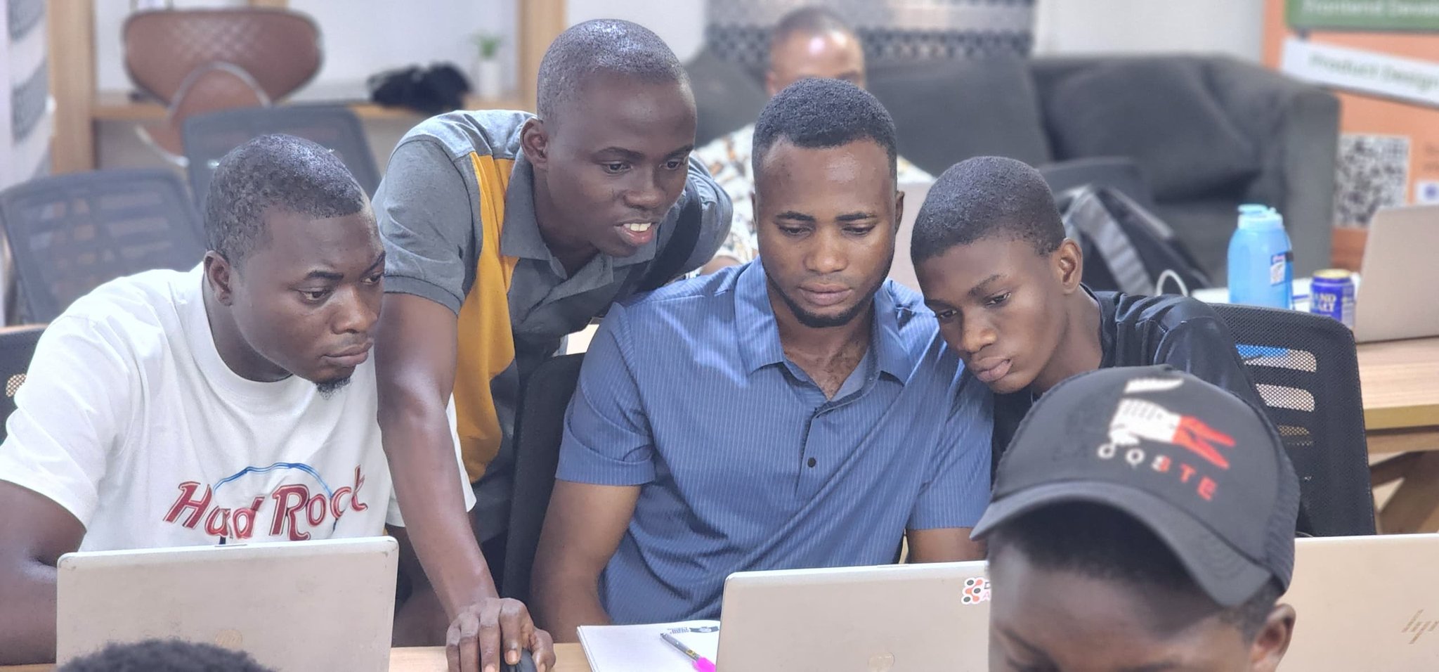 DLT Africa cohort collaborating at laptops